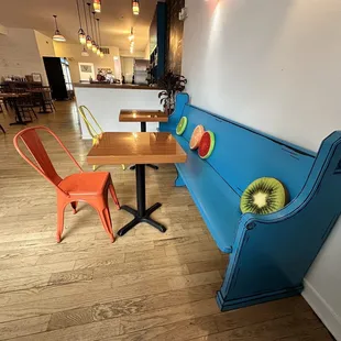 a blue bench with kiwi slices on it