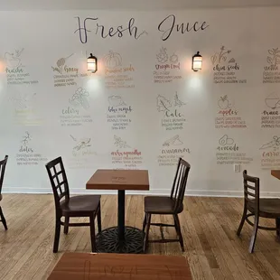 a dining area with tables and chairs