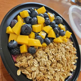 a bowl of oatmeal and fruit