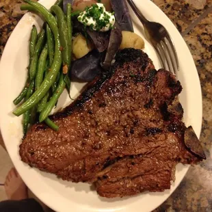 T Bone Steak with steamed potatoes and garlic green bean