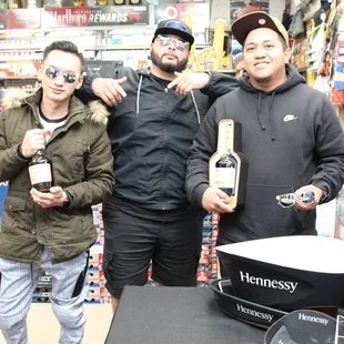 three men standing in a store