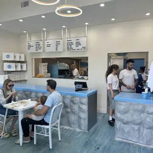 Inside feels like Mykonos. Unmatched vibes for a casual neighborhood pizza pasta joint.