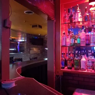 a drink in a plastic cup on a bar counter