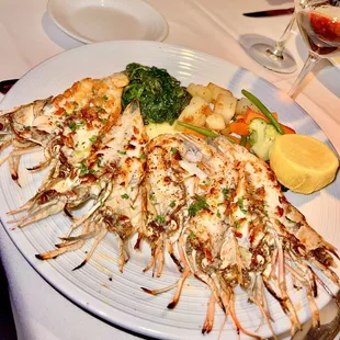 a plate of grilled shrimp