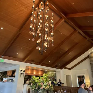 a dining room with a large chandelier