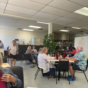 a group of people sitting around a table