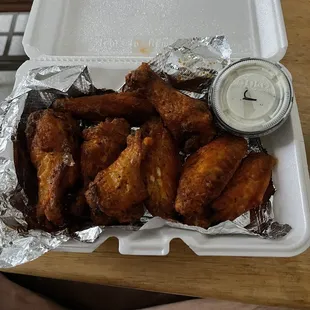 chicken wings in a styrofoam container