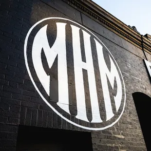 The Madhouse Motors Logo, painted on the outside of our building.