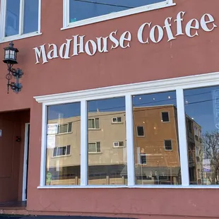 the reflection of a building in the windows