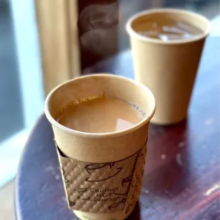 Small cup of pour over coffee with a splash of cream :) their staff is friendly :)