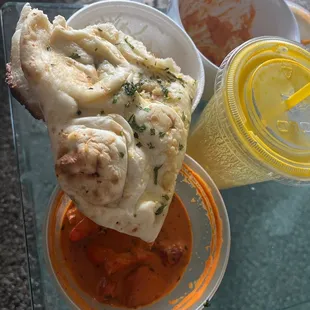 18. Butter Chicken 80. Garlic Naan 89. Lassi (Mango)