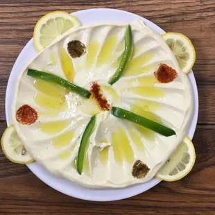 a white plate topped with a lemon cake