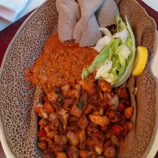 Chicken chop chpp, 11.99. Comes with beans, lettuce, and choice of spagettie, rice, or injera. I had injera Ethiopian sour bread) today.