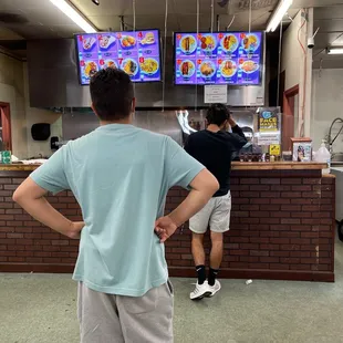 a man standing in front of a counter