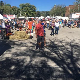 At the corner of the art booths and the food. I see Audrey's in the corner, which means pumpkin rolls!!
