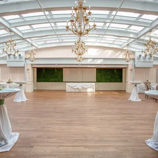 a banquet room set up with tables and chairs
