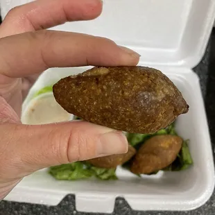 Fried Kibbeh about the size of a large egg.