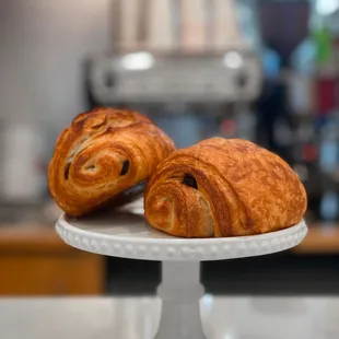 Exquisite pain au chocolat: layers of buttery pastry hugging rich chocolate. A French delight that promises pure indulgence in every bite.