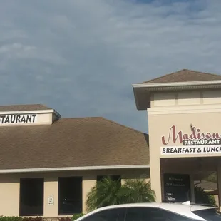 a car parked in front of the restaurant