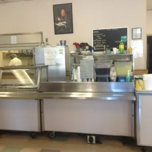 a stainless steel counter with a stainless steel top