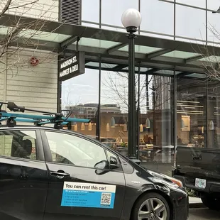 a car with a surfboard on the roof