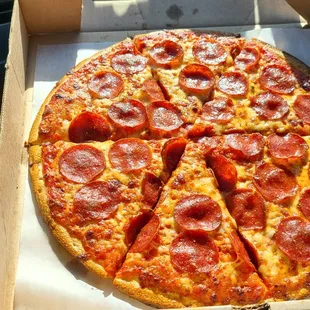 a pepperoni pizza in a box