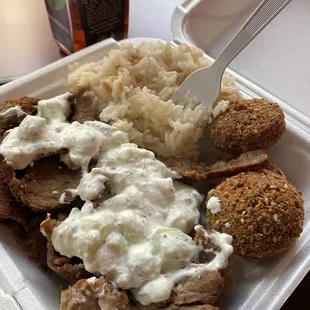 a plate of meat and rice