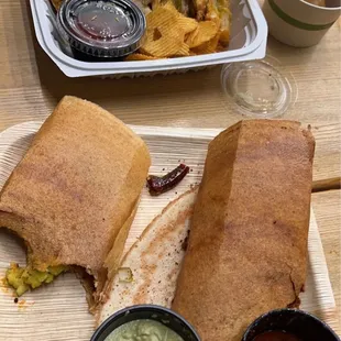 Dosa with potatoes and spicy red chutney