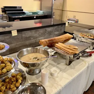 a variety of food items on a buffet table