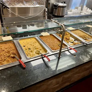 a variety of food items in a buffet