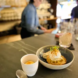 a plate of food and a cup of coffee