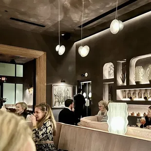 a group of people sitting in a restaurant