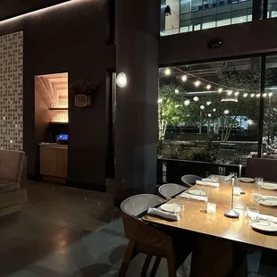 a dining room with a view of the city