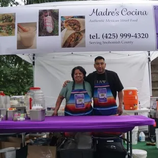 a man and woman under a tent