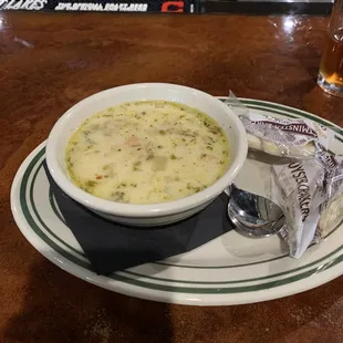 a bowl of soup and chips