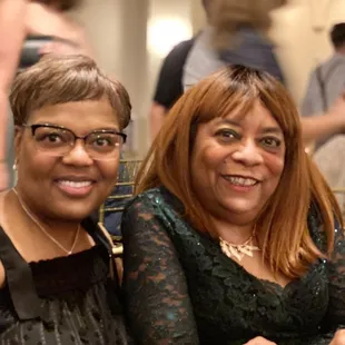 two women sitting at a table