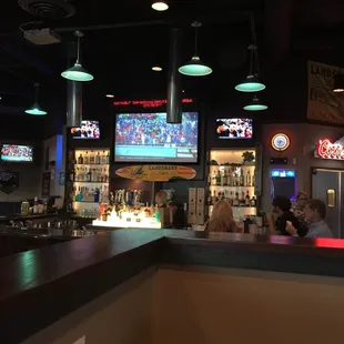 a sports bar with neon lights