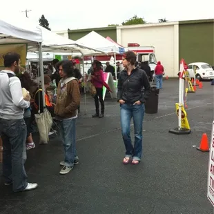 a woman standing in a parking lot