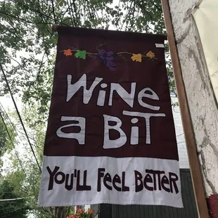 a sign that says, wine is bit you&apos;ll feel better