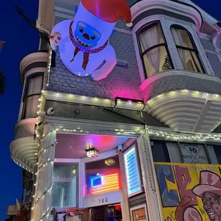 a snowman on the roof of a building