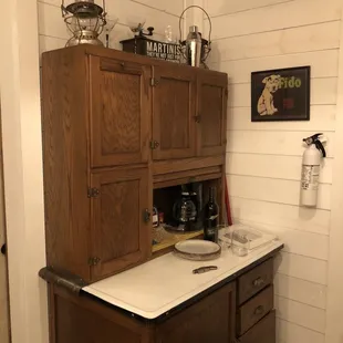 Vintage kitchen cabinet complete with a bottle of wine upon arrival