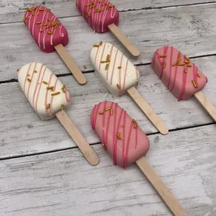 a variety of pink and white ice cream pops