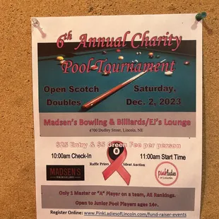 a poster for the annual charity pool tournament