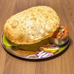 a plate of food on a wooden table