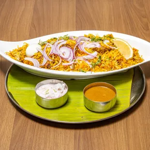 a dish of rice with onions and onion
