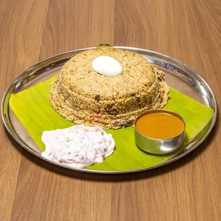 a plate of food on a wooden table