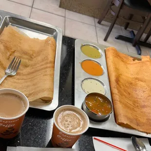 Partial eaten Masala Dosa, Mysore Masala Dosa and chai.