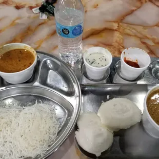 Veg kurma with idyappam and idli.