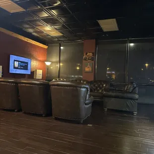 leather couches and a flat screen tv