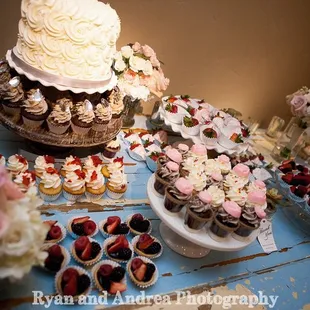 a wedding cake and cupcakes